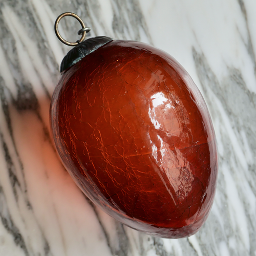 burnt orange oval glass ornament